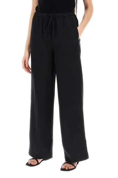 Shop Totême Toteme Lightweight Linen And Viscose Trousers In Black
