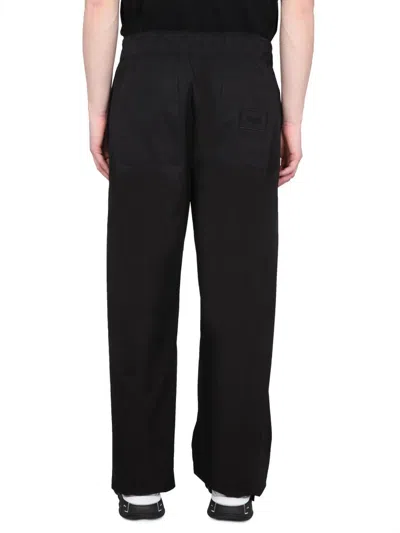 Shop Versace Drawstring Pants In Black