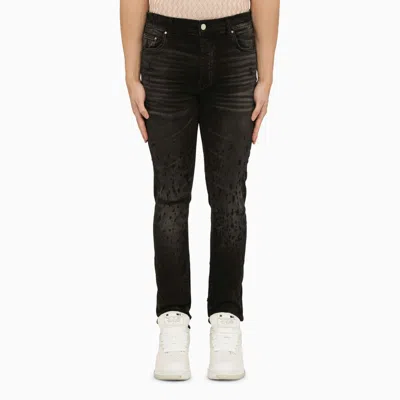 Shop Amiri | Faded Black Distressed Skinny Jeans