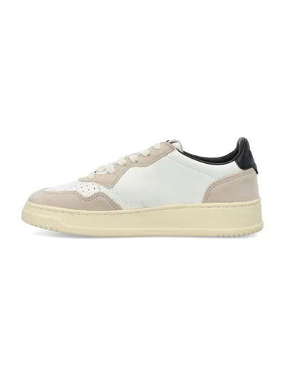 Shop Autry Medalist Low Woman Sneakers In White/black