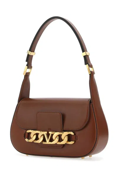 Shop Valentino Garavani Handbags. In Brown