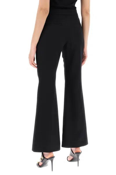 Shop Balmain Flared Pants With Embossed Buttons In Black