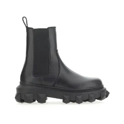 Shop Valentino Trackstud Leather Boots In Black