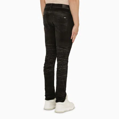 Shop Amiri Faded Black Distressed Skinny Jeans