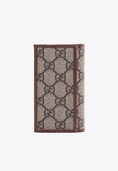 Shop Gucci All-over Interlocking Gg Wallet In Brown