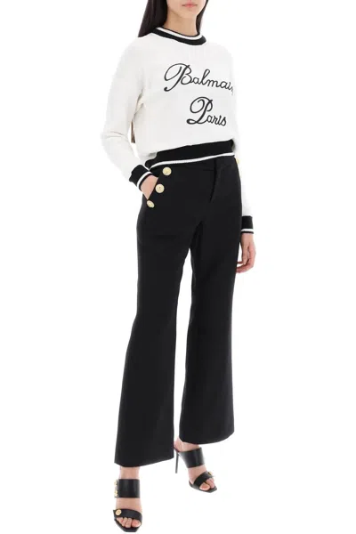 Shop Balmain Flared Pants With Embossed Buttons