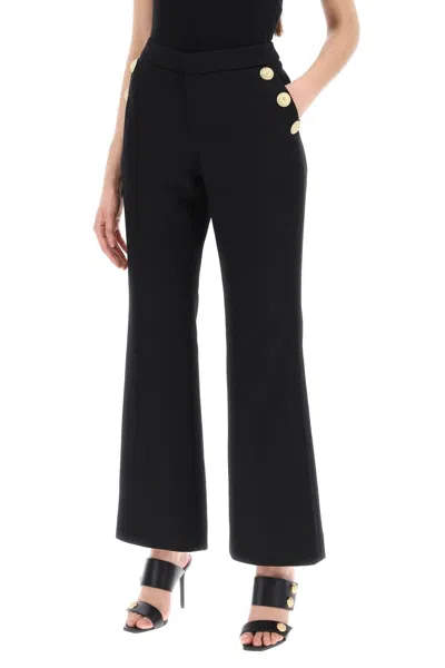 Shop Balmain Flared Pants With Embossed Buttons