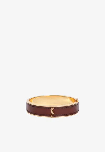 Shop Saint Laurent Cassandre Logo Leather Rigid Bracelet In Brown