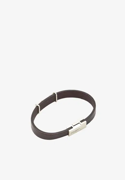 Shop Saint Laurent Cassandre Tanned Leather Bracelet In Brown