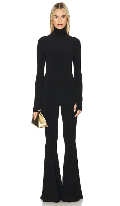 Shop Norma Kamali Long Sleeve Turtleneck Fishtail Jumpsuit In 黑色
