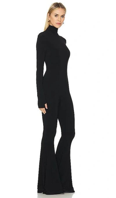 Shop Norma Kamali Long Sleeve Turtleneck Fishtail Jumpsuit In 黑色