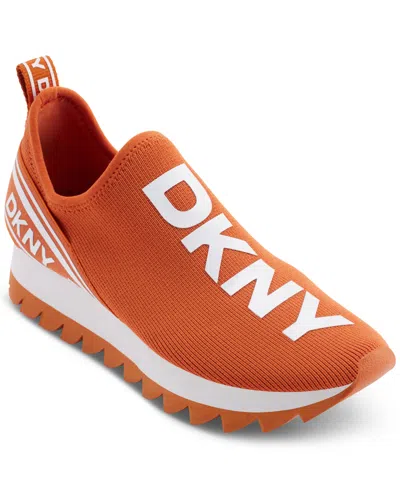 Shop Dkny Abbi Slip-on Logo Sock Sneakers In Spicy Orange