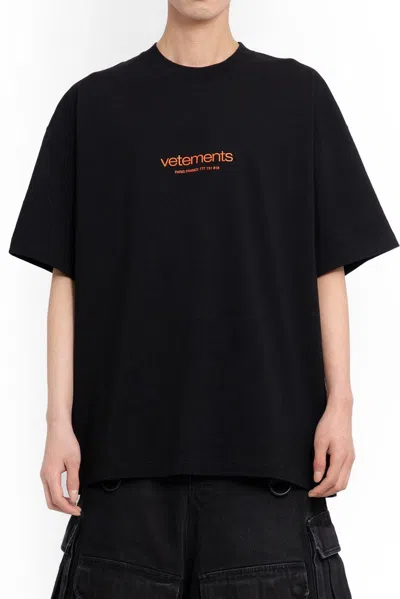Shop Vetements Logo Printed Round Neck T-shirt In Black