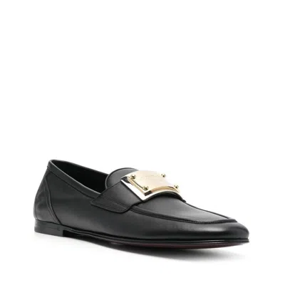 Shop Dolce & Gabbana Leather Logo Loafers In 黑色的