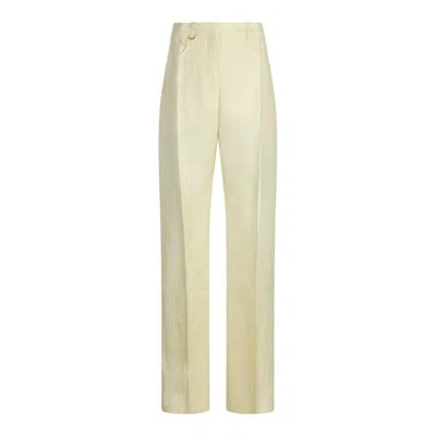 Shop Jacquemus Trousers In Pale Yellow