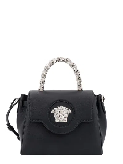 Shop Versace Handbag In Black