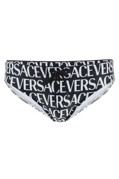 Shop Versace Allover Swim Briefs In Black White (white)