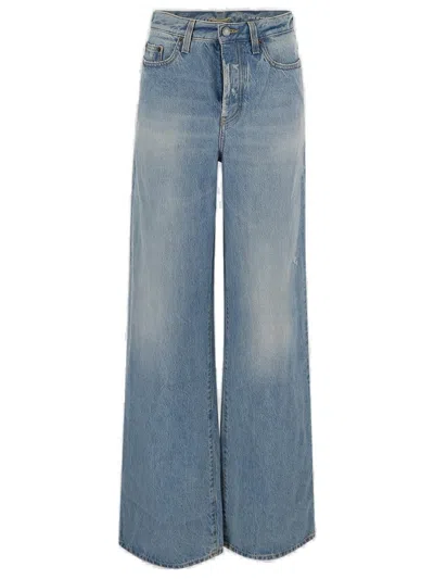 Shop Saint Laurent Cotton Denim Flared Jeans
