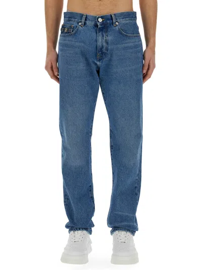 Shop Versace Regular Fit Jeans In Denim