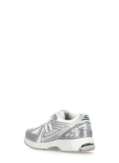 Shop New Balance Sneakers Silver