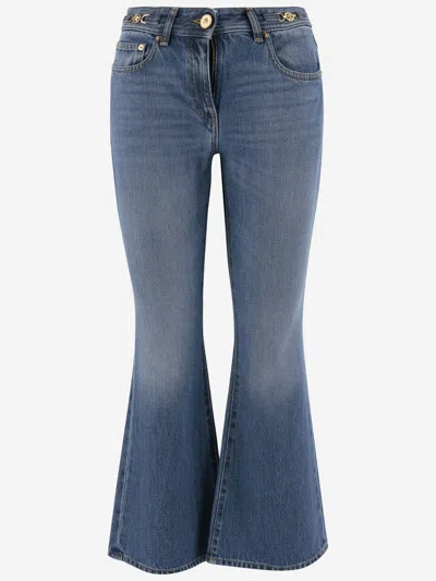Shop Versace Flexed Jeans In Denim