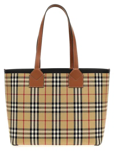 Shop Burberry 'london' Midi Handbag In Brown