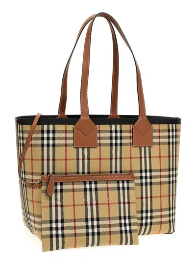 Shop Burberry 'london' Midi Handbag In Brown