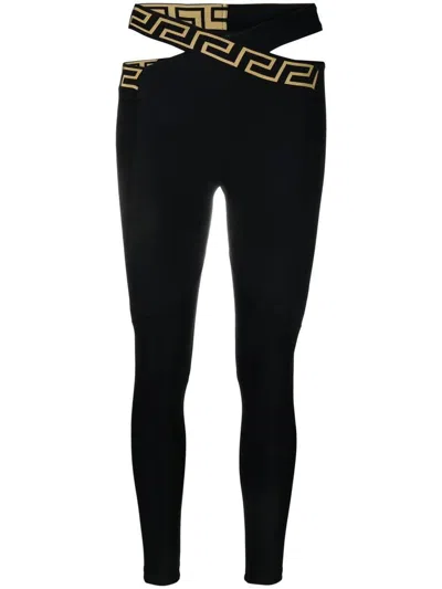 Shop Versace Leggings With Crossed Belt In Black