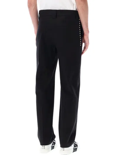Shop Valentino Garavani Pants With Studs In Black