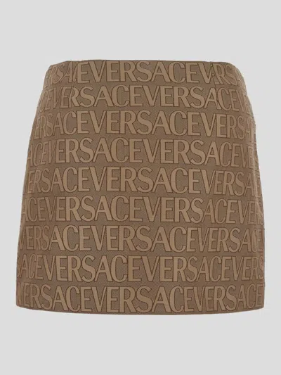 Shop Versace All-over Logo Mini Skirt In Brown+beige