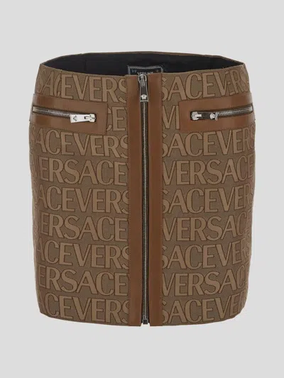 Shop Versace All-over Logo Mini Skirt In Brown+beige