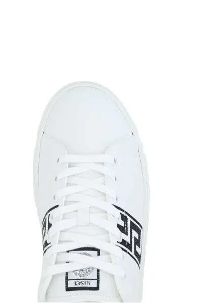 Shop Versace Sneakers In White+black