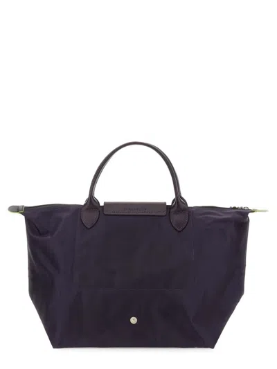 Shop Longchamp Le Pliage Medium Bag In Purple