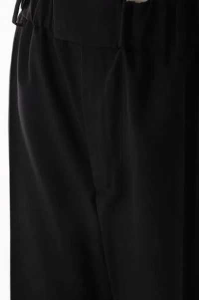 Shop Bottega Veneta Trousers In Black