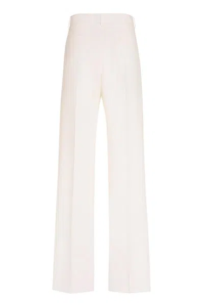 Shop Valentino Wool Trousers In Ivory