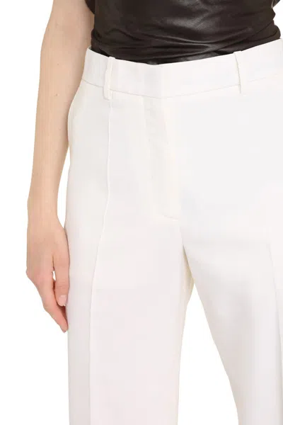 Shop Valentino Wool Trousers In Ivory