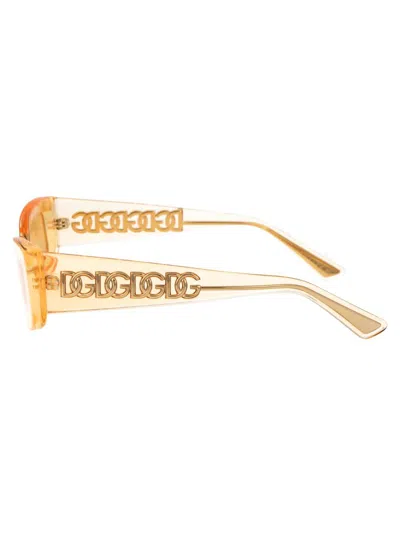 Dolce & Gabbana Eyewear Rectangular Frame Sunglasses In 3046/7 Orange Transparent
