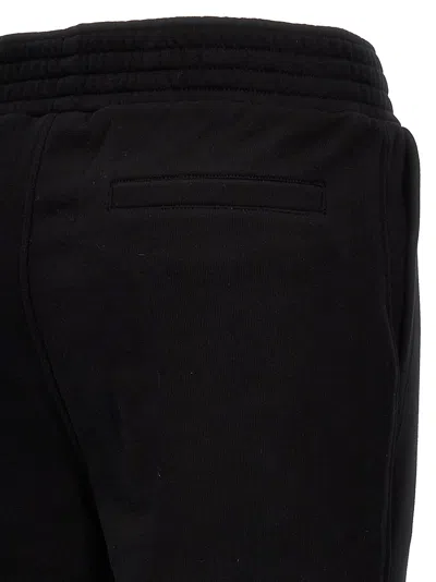 Shop Givenchy Flocked Logo Joggers Pants Black