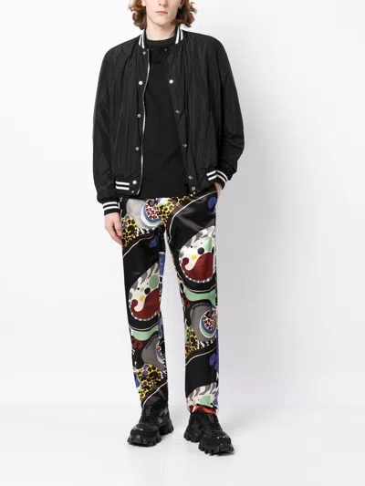 Shop Moschino Abstract-print Straight-leg Trousers