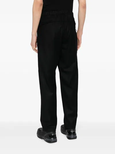 Shop Goldwin All Direction Straight-leg Trousers