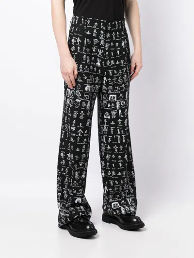 Shop Vivienne Westwood All Over Graphic Print Trousers