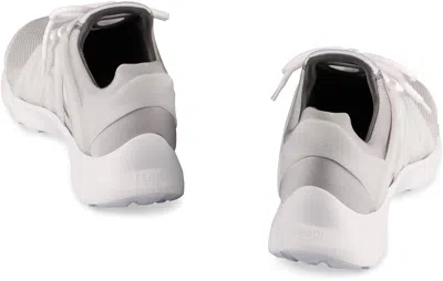 Shop Fendi Tag Low-top Sneakers In White