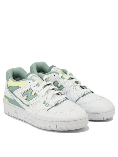 Shop New Balance "550" Sneakers