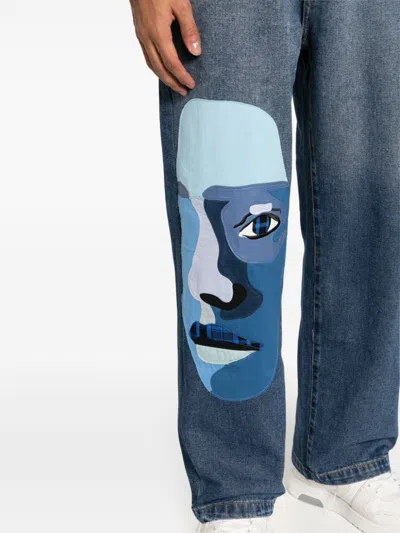 Shop Kidsuper Face-patchwork Straight-leg Jeans