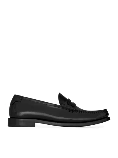 Shop Saint Laurent Le Loafer Penny Slippers In Glazed Leather In Black