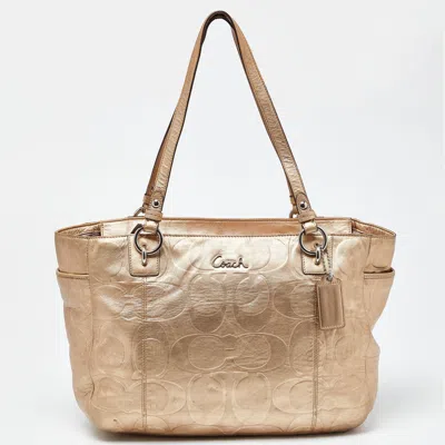 Shop Coach Gold Signature Embossed Leather East West Gallery Tote