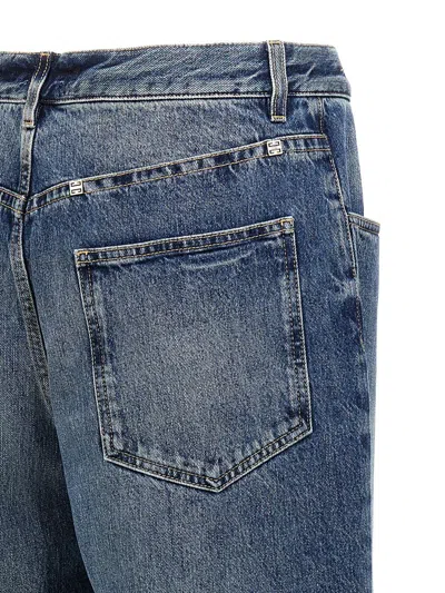 Shop Givenchy Logo Plaque Jeans In Blue