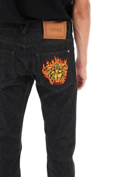Shop Versace Medusa Flame Jeans In Nero