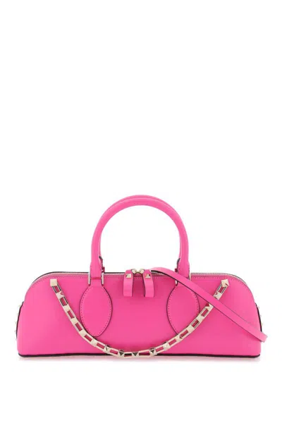 Shop Valentino Rockstud E/w Leather Handbag In Fuxia
