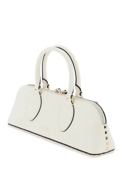 Shop Valentino Rockstud E/w Leather Handbag In Bianco
